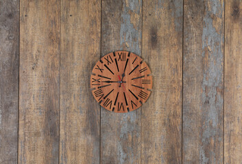 vintage wooden clock on a wooden wall