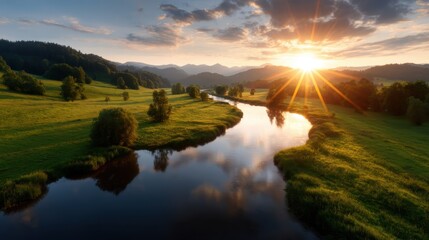 A breathtaking sunset illuminates the hills and river, creating a stunning reflection and enhancing the natural beauty of this serene landscape with vibrant colors.