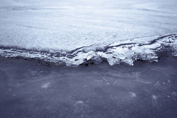 Broken Ice on Frozen Lake or River in Cold Weather