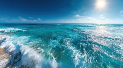 An expansive view of the vibrant blue ocean waves gently crashing on the shore under a bright sun, symbolizing freedom, joy, and the beauty of the sea.