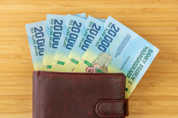 Madagascar money. Madagascar ariar, 20000 banknotes sticking out of the wallet. Currency MGA. Business and financial concept. close up