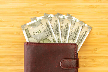 India money. Indian rupees, 500-rupee bills sticking out of a wallet. The currency is INR. Business and financial concept.