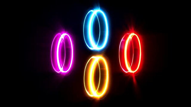Four luminous rings, purple, blue, yellow, and red, glow against a dark backdrop