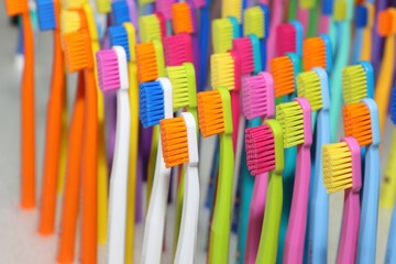 Nicely arranged toothbrushes in different colors
