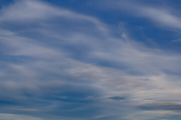 Blue Sky Background with Thin Layered Cirrus and Altocumulus Clouds
