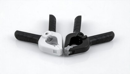 A studio shot presents two sturdy clamps, one white and one black, resting against each other on a glossy white surface. The angle showcases details