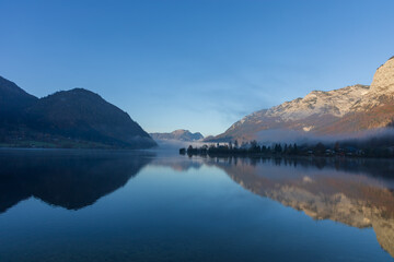 The beautiful mountain lake Grundlsee at the southern foot of the Totes Gebirge mountains in the Styrian part of the Salzkammergut in Austria