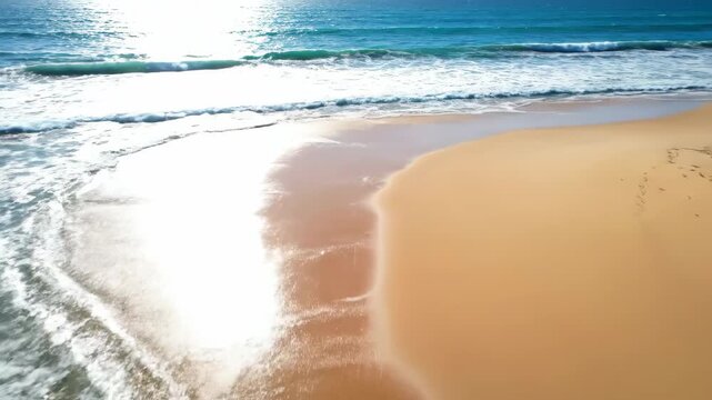 Drone flying forward over turquoise ocean waves crashing onto a pristine, secluded sandy beach on a sunny afternoon view, sea, waves