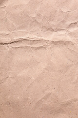 Vertical crumpled distress old brown parchment paper texture