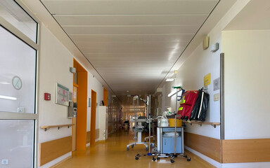 Hospital corridor with medical carts, emergency defibrillator, clinical environment, healthcare equipment ready for use, urgent care, modern hospital infrastructure, Frankfurt - August 20, 2025