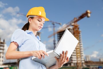 Fototapeta premium Female young Architect Working with laptop