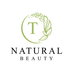 Initial letter t cosmetics beauty fashion logo design, green leaves natural logo graphics concept