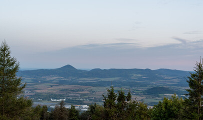 Wide landscape view of mountains and valley at dusk