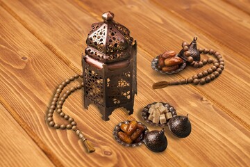 Ornamental Arabic lantern and dates on plate