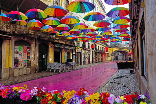Pink Street (Rua Nova do Carvalho) This street is famous for its pink-painted pavement and the colorful umbrellas suspended above the heads of passer 29 May 2025 Lisbon Portugal