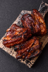 Grilled or barbecued pork ribs with sauce. Grilled ribs