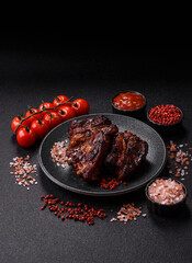 Grilled or barbecued pork ribs with sauce. Grilled ribs