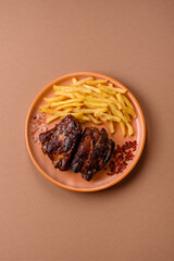 Grilled or barbecued pork ribs with sauce. Grilled ribs