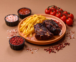 Grilled or barbecued pork ribs with sauce. Grilled ribs