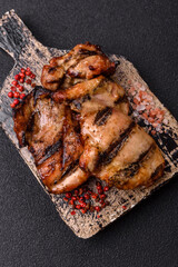 Chicken breast cooked on a grill or barbecue with sauce. Grilled chicken