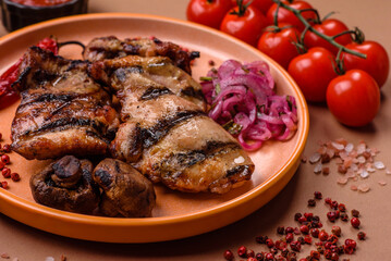 Chicken breast cooked on a grill or barbecue with sauce. Grilled chicken