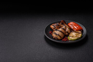 Chicken breast cooked on a grill or barbecue with sauce. Grilled chicken