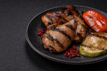Chicken breast cooked on a grill or barbecue with sauce. Grilled chicken