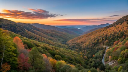 Majestic mountain valley bathed in the warm glow of a vibrant sunset