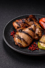 Chicken breast cooked on a grill or barbecue with sauce. Grilled chicken
