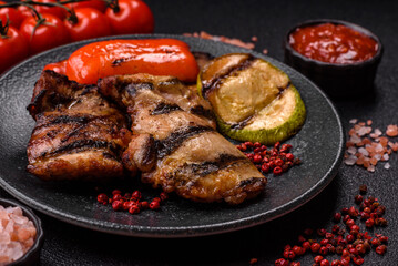 Chicken breast cooked on a grill or barbecue with sauce. Grilled chicken