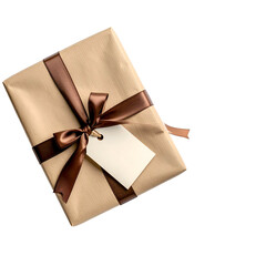 A wrapped rectangular gift, brown paper and ribbon, a blank tag, against black