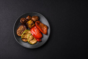 Grilled vegetables, bell peppers, mushrooms, and zucchini, a vegetarian meal. Grilled vegetables