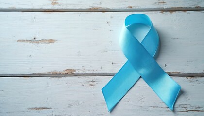 Light blue awareness ribbon on rustic white wood background. The photo represents health concept with focus on HPV education prevention cervical cancer awareness. Symbolic image for medical campaigns