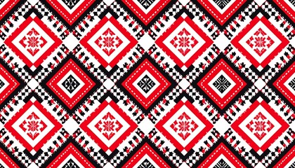 A repeating geometric pattern, featuring red and black diamond shapes with intricate floral details set on a white background