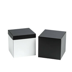 Fototapeta premium Two square boxes; one white with black lid, other black; isolated on black background