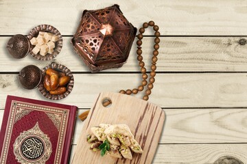 Ornamental Arabic lantern and dates on plate