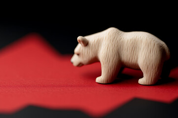 Symbolic wooden bear on a downward trending chart. Evokes imagery of economic downturn and financial challenges in a simple, graphic representation.
