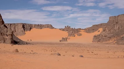 Fototapeten Naturpark A trip to Sahara desert in Algeria. Beautiful  african travel photo. Sandy landscapes, mountains, rocks, dunes, and nature. Summer vacation in arab country.  © TKalinovskaya