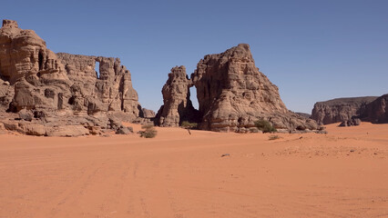 A trip to Sahara desert in Algeria. Beautiful 
african travel photo. Sandy landscapes, mountains, rocks,
dunes, and nature. Summer vacation in arab country.