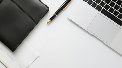 A sleek workspace featuring a black notebook, a luxurious pen, and a laptop on a clean white desk, exuding professionalism and productivity.