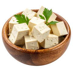 Cubed, soft, light-colored food in a wooden bowl, garnished with green leafy herb