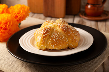Pan de Muerto. Typical Mexican sweet bread that is consumed in the season of the day of the dead. It is a main element in the altars and offerings in the festivity of the day of the dead.