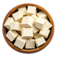 Overhead shot of a wooden bowl filled with fresh, cubed, off-white tofu on a black background