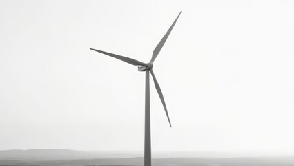 Fototapeta premium Wind turbine against pale sky