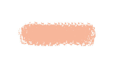 Textured peach colored brush stroke with rough edges isolated on a stark black background