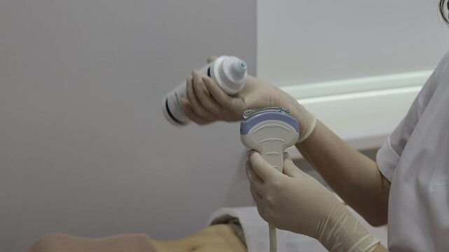 Ultrasound Gel Application 4k video. Ultrasound gel is applied to the transducer for effective soundwave conduction. Applying gel to the ultrasound device eliminates air gaps.