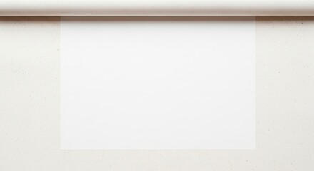 Minimalist blank white sheet of paper taped to a neutral wall, offering a clean space for creativity, notes, sketches, or messages in a simple, uncluttered, and versatile setting.

