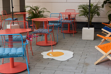 A Beautiful and Colorful Outdoor Seating Area that Features an EyeCatching Egg Design