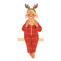 Cute girl child wearing festive pajamas and reindeer headband eating Christmas cookies on bench
