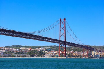 Ponte 25 de Abril Bridge in LisbonюView of famous Lisbon bridge over Tagus river.